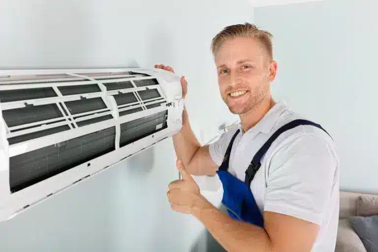 tech performing AC maintenance in tempe, az